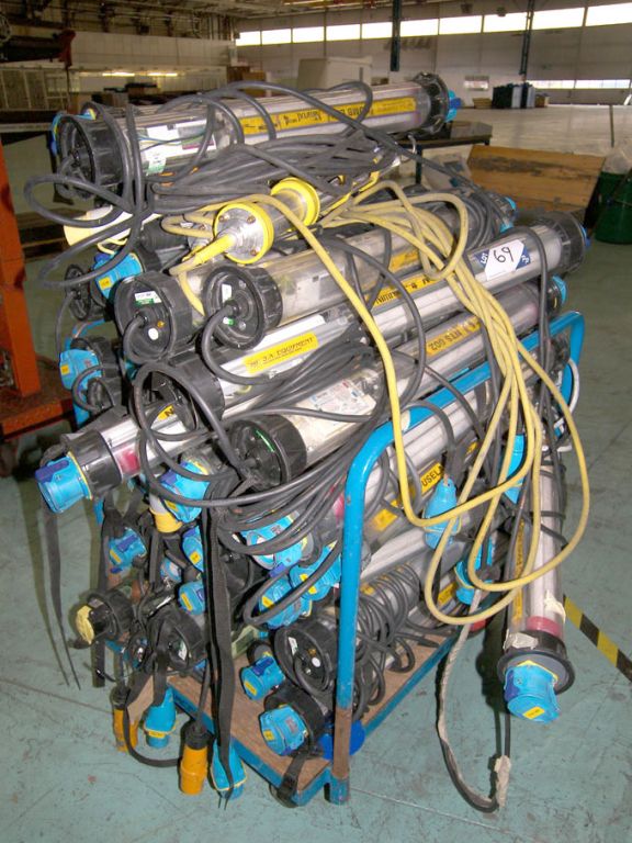 Qty various enclosed fluorescent light fittings on...
