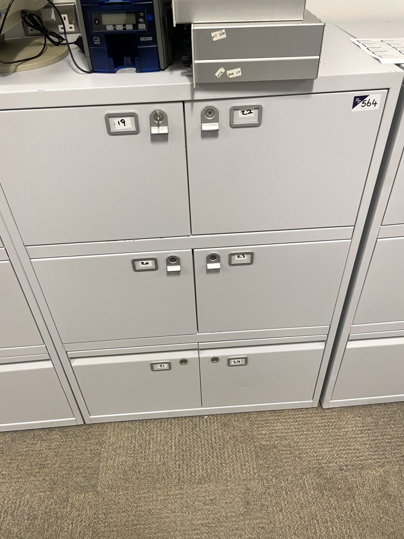 Grey metal storage cupboard inc: 4x locker compart...