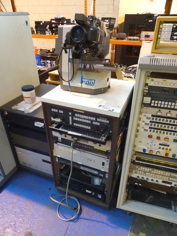 Mobile storage rack with contents inc: Philips vid...