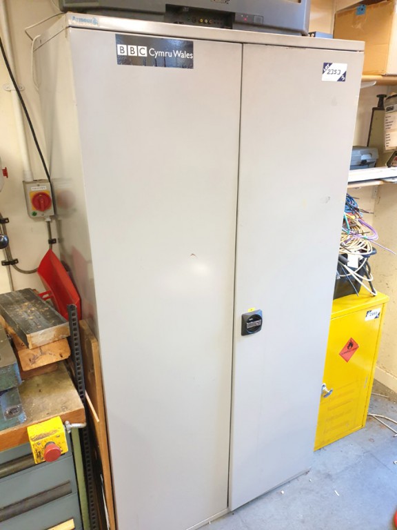 2 door storage cupboard with various plastic stora...