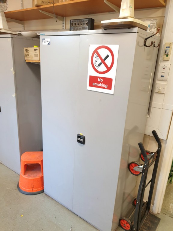 2 door storage cupboard with various contents