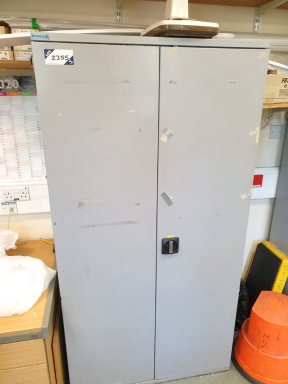 2 door storage cupboard with various contents