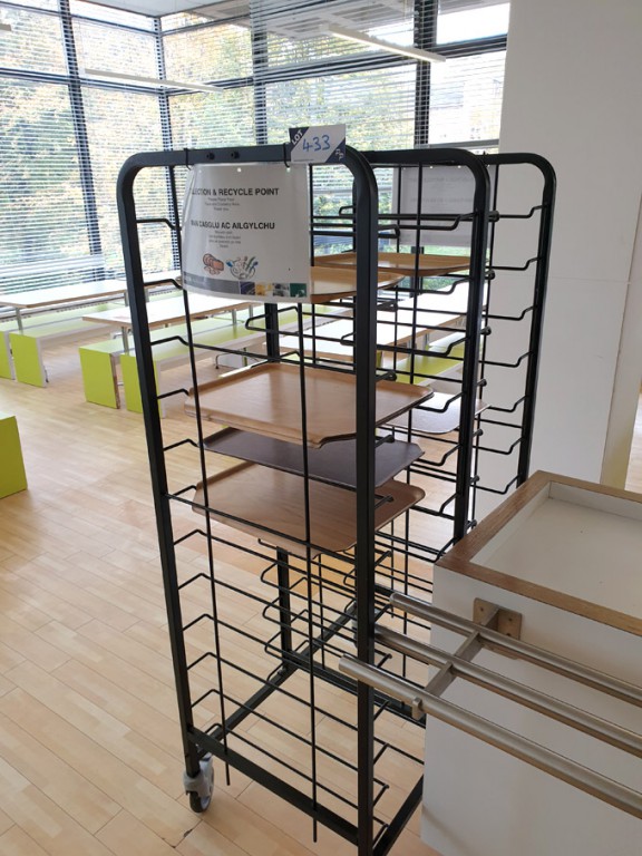 2x black mobile serving tray trolleys