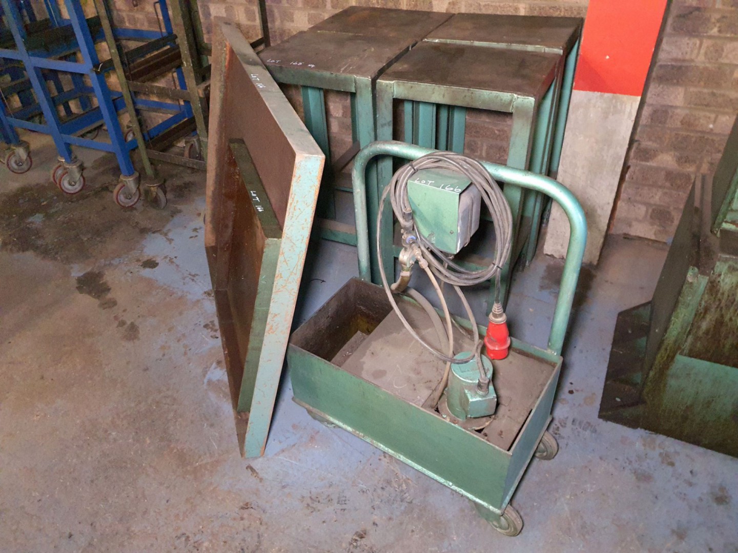 2x metal drip trays with mobile coolant pump