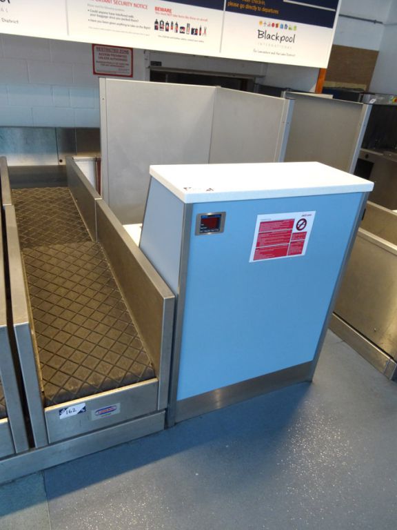 Check-in desk with Logan powered luggage conveyor,...
