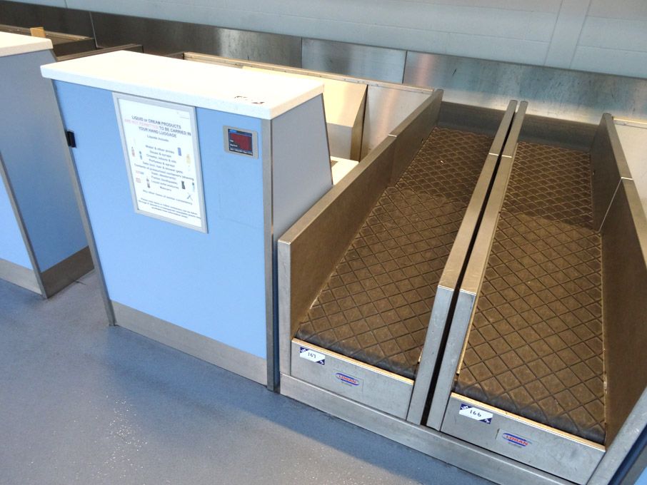 Check-in desk with Logan powered luggage conveyor,...