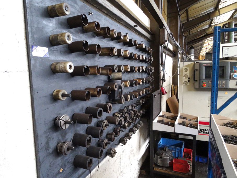 Qty various collets on wall mounted rack
