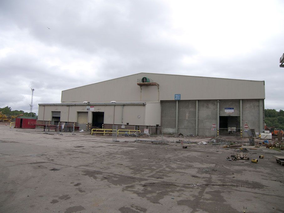 90x70m approx metal clad building, 4x roller shutt...