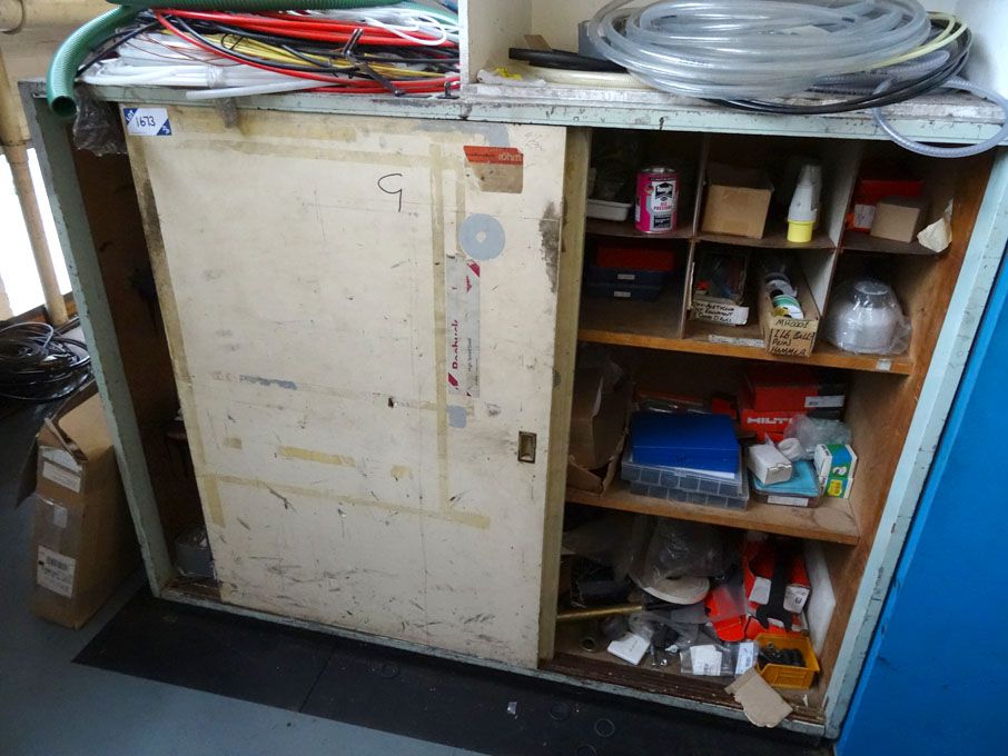 Twin sliding wooden storage cupboard with contents...