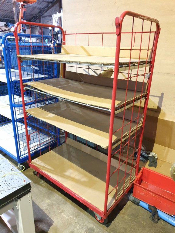 Mobile red metal cage multi shelf storage trolley...