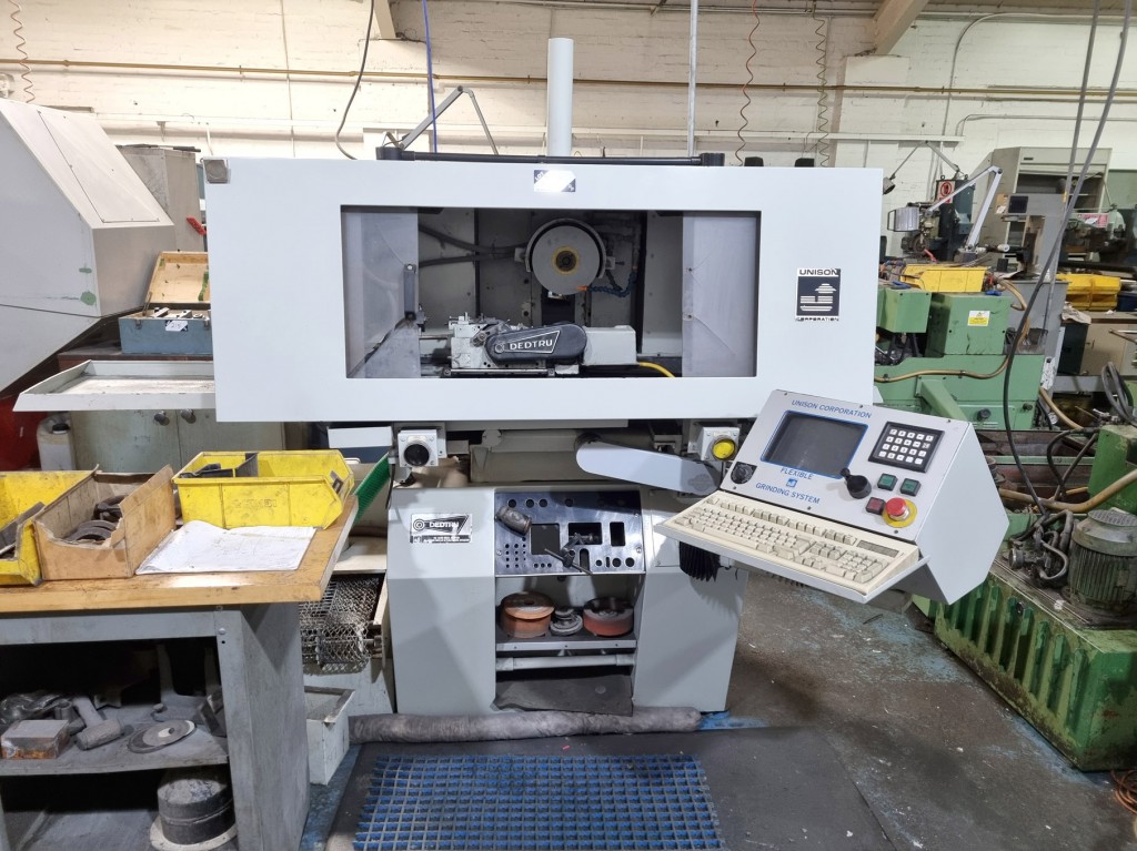 Unison Corporation 2100 CNC flexible grinding syst...