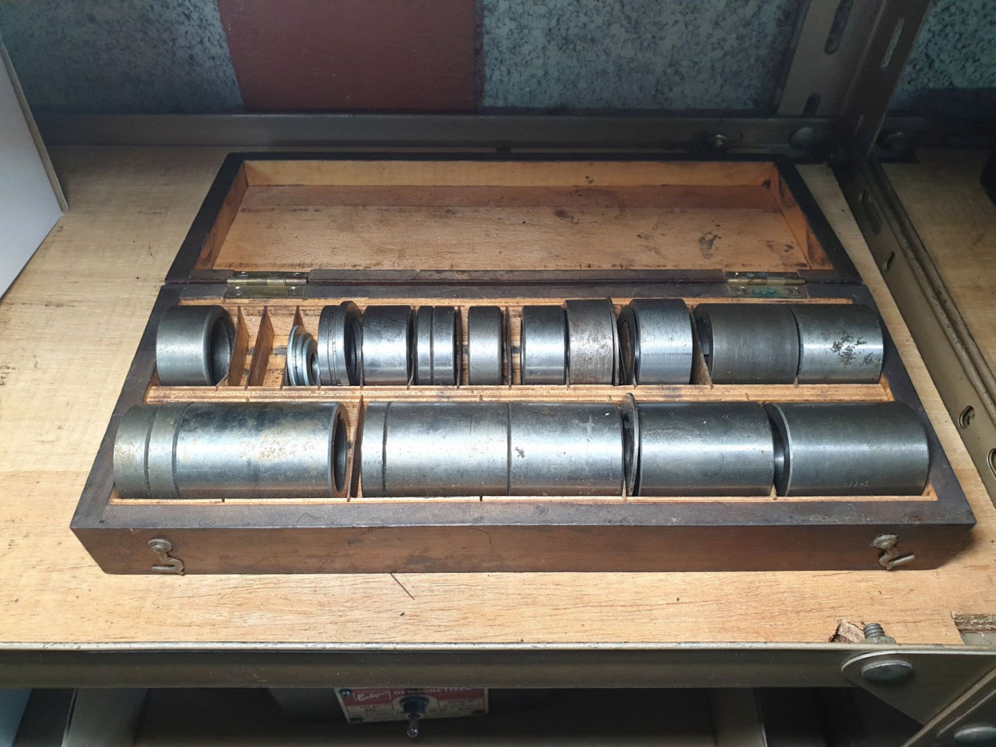 Milling cutter spacers set in wooden box, 1” bore