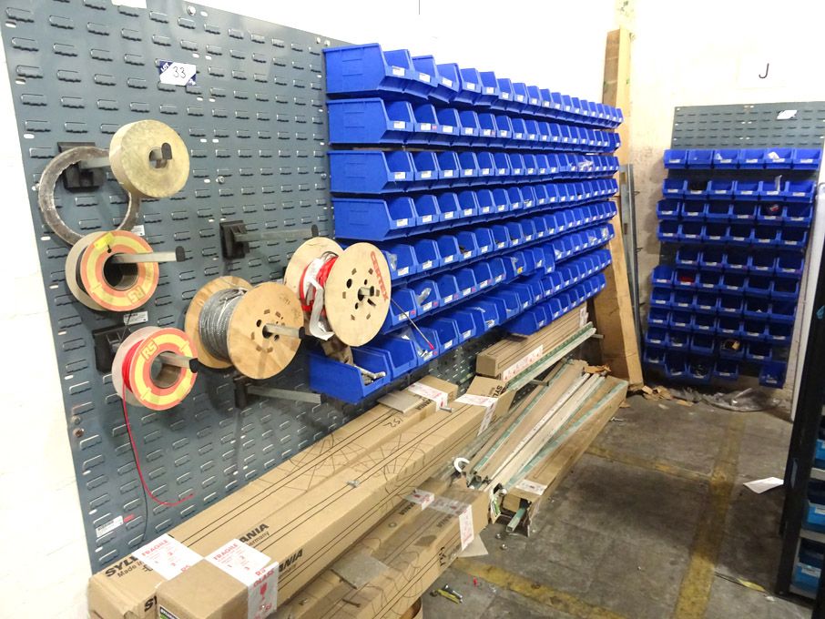 Wall mounted plastic bin storage racks with conten...
