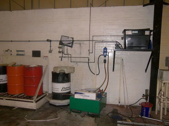 Dosatron coolant mixing system with barrel drip tr...