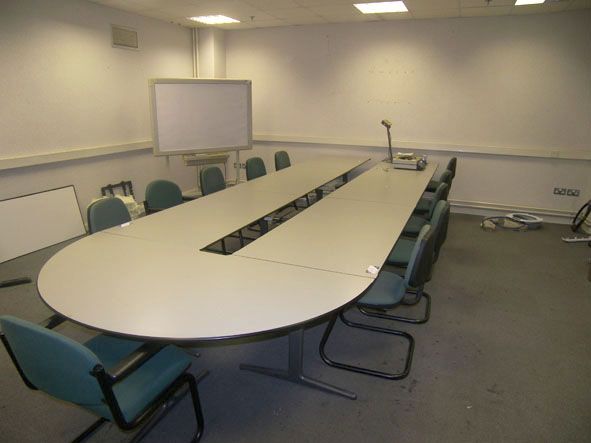 U' shape meeting table with 13x green upholstered...