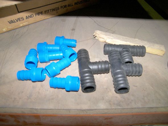 Qty various plastic hose fittings in metal stillag...