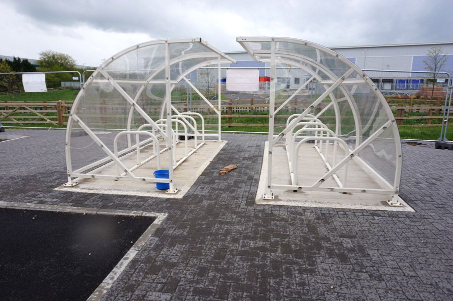 Twin weather shielded motor bike parking shelter,...