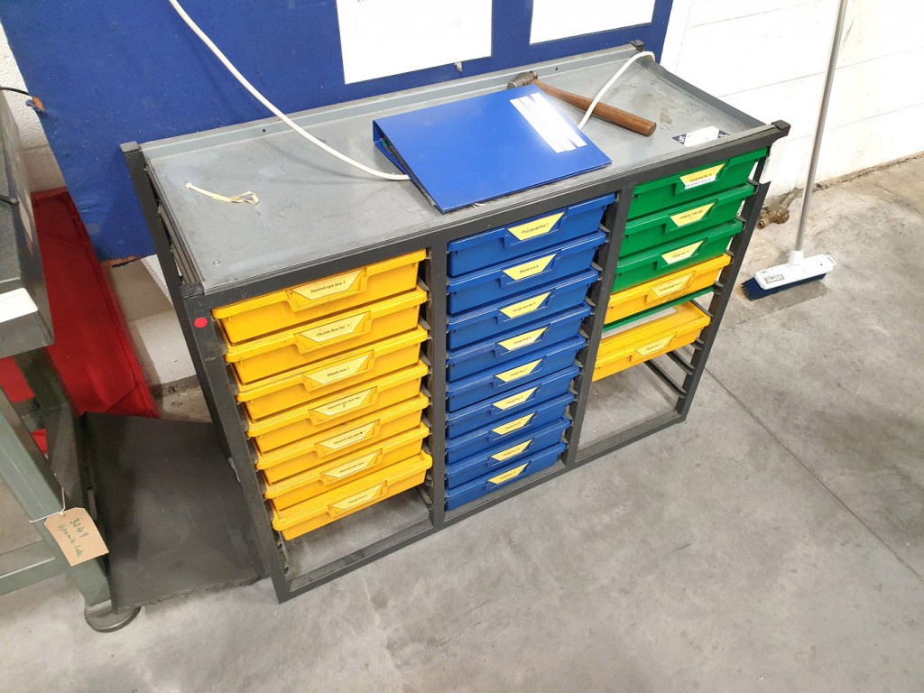 27 compartment metal frame storage unit with Qty p...