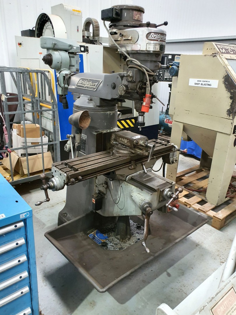 Bridgeport belt head turret mill, 42x9” table, pow...