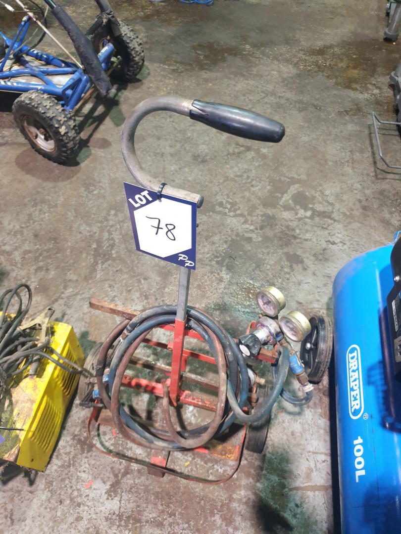 BOC gas regulators with oxyacetylene torch on trol...