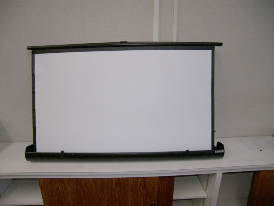 Sahara retractable projector screen in metal case